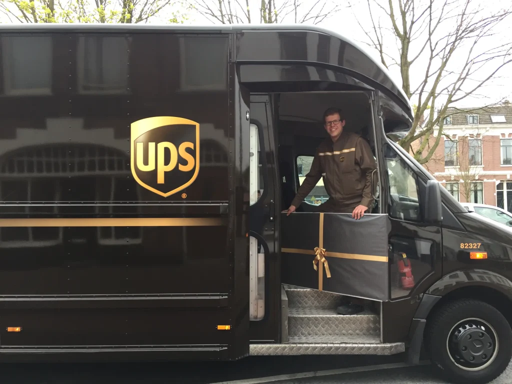 UPS driver collects a illuminated world map in gift paper